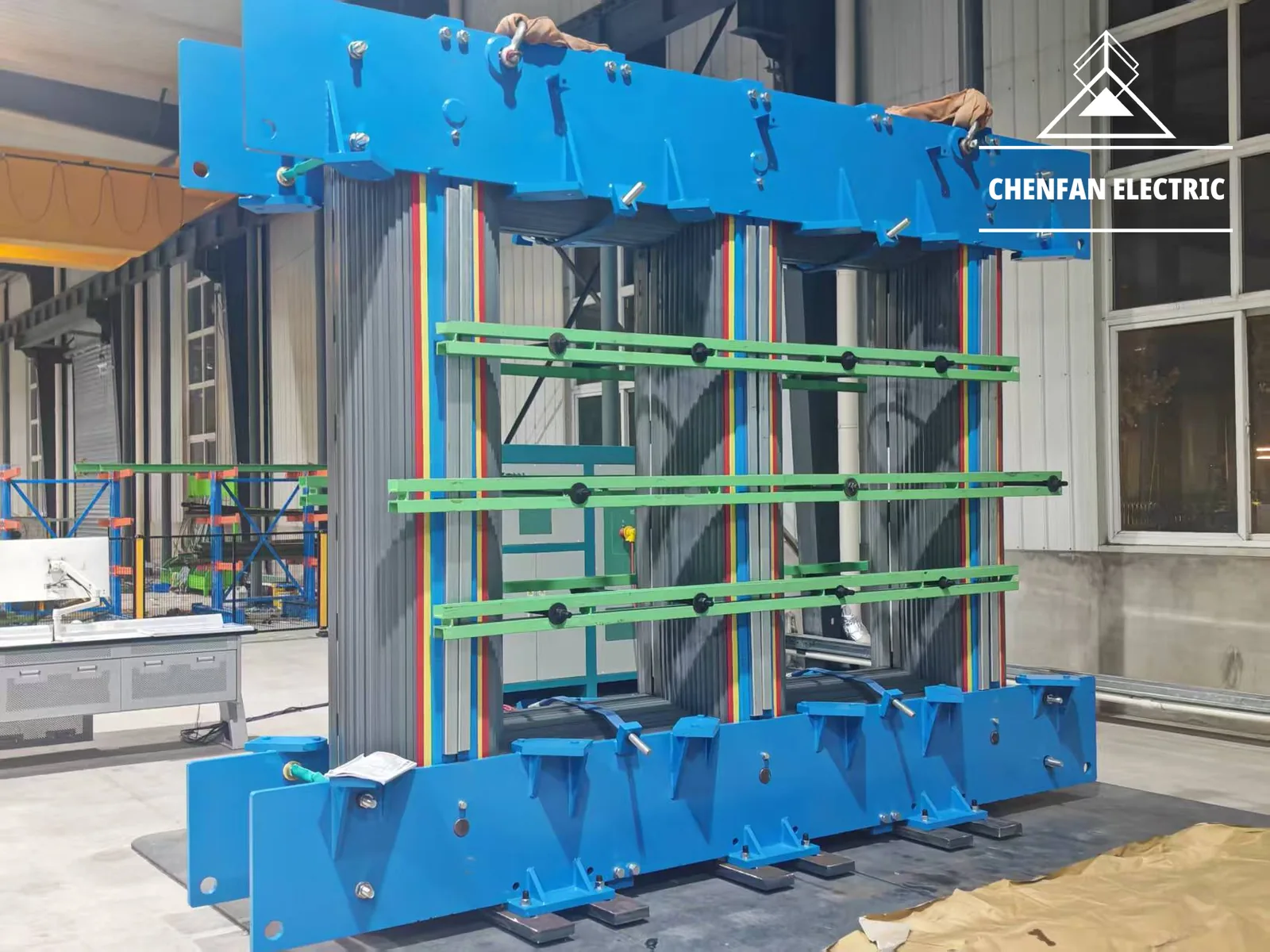 Blue-framed transformer core in production