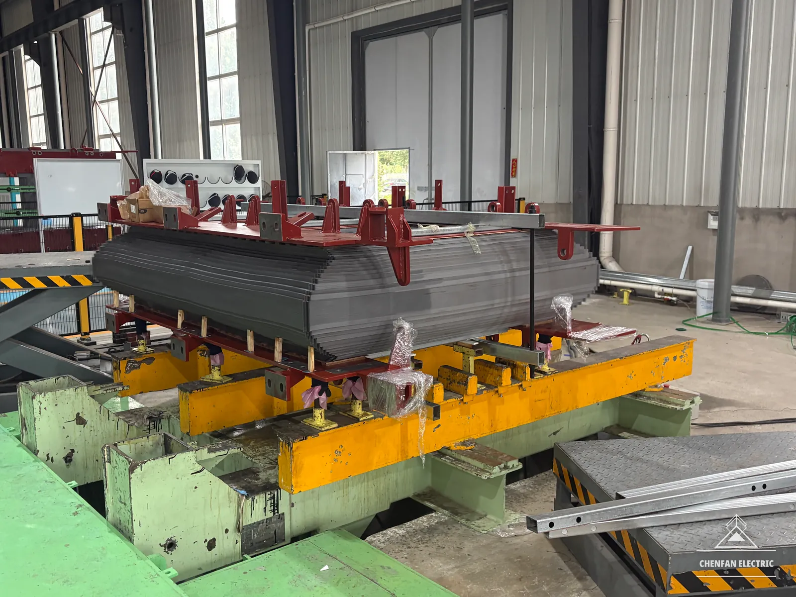 Transformer-core laminations secured in a clamping fixture
