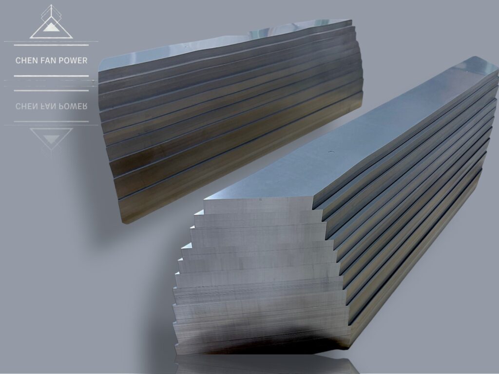 Close-up sample of laminated silicon steel sheets used in transformer core construction.